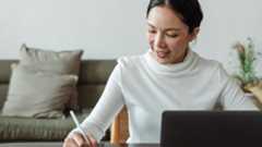 Download Adobe Sign: Woman writing with digital stylus