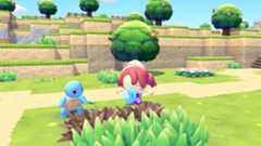 Ditto and Squirtle working together to water dry grass in Pokemon Pokopia