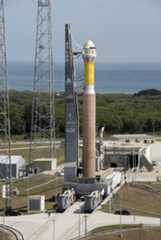 A Boeing CST-100 spacecraft is shown atop a United Launch Alliance Atlas 5 rocket in this artist's illustration. The CST-100 is a capsule-based vehicle designed to carry seven astronauts into low-Earth orbit on trips to the International Space Station or other orbital destination.