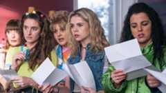 the cast of Derry Girls hold papers in Derry Girls season 3
