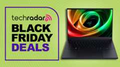 Razer Blade 14 (2025) gaming laptop against a light green TechRadar deals background