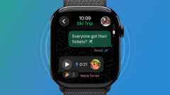 An Apple Watch on a green and blue background showing the WhatsApp app