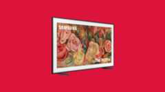 An angled shot of the Frame TV, on a kind of pink background. 