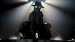 Nicolas Cage's The Spider crouched down in Spider-Noir