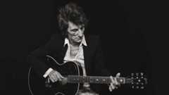 Ronnie Wood with an acoustic guitar (studio portrait)