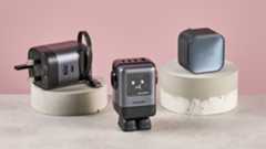 Anker 45W charger, UGreen Uno Charger 100W, and UGreen charger with retractable cable on pink background