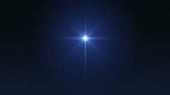 A bright star twinkles in a deep blue night sky