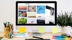 A desktop with a colourful portfolio on screen