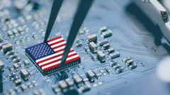 A US flag atop a silicon computer chip