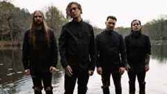 Lorna Shore standing in a lake