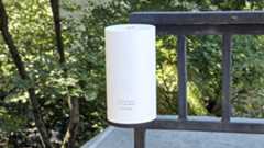 TP-Link Deco BE65-Outdoor mounted on a railing