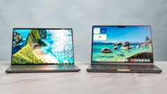 Dell XPS 14 vs. MacBook Pro M5 side by side on a table.