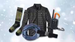 A collection of ski and snowboard accessories including a Patagonia jacket, Rocky Talkie Mountain Radio, Smartwool socks, and a Buff neck gaiter