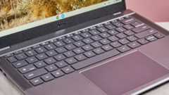 Close-up of keyboard and touchpad on Acer Chromebook Plus 516, open on desk with pink background