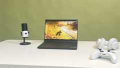 A Razer Blade 14 2025 on a desk playing Helldivers 2