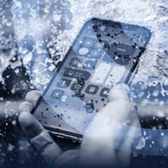 A smartphone under running water