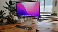 Studio Display on wooden desk