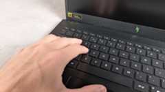 Fingers on keyboard of Acer Nitro V 15