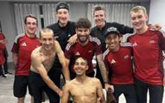 Ineos Grenadiers riders posing for a photo, with Michal Kwiatkowski and Brandon Rivera sporting shaved heads, whilst Filippo Ganna holds electric clippers