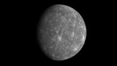 a grey planet covered in craters against the blackness of space