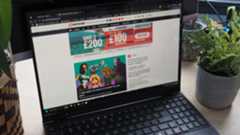 A laptop on a desk with its screen open