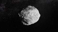 Artist's illustration of an asteroid in deep space.