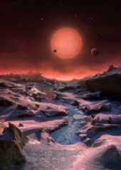 This artist's illustration depicts an imagined view from the surface of one of the three newfound TRAPPIST-1 alien planets. The planets have sizes and temperatures similar to those of Venus and Earth, making them the best targets yet for life beyond our s