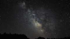 a wisp of white light crosses the night sky