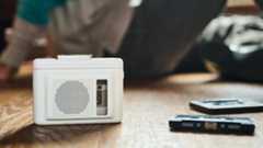 Maxell MXCP-P100S cassette player on a wooden surface. It's a Walkman-esque player with a built-in speaker