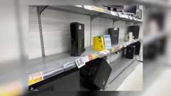 A picture of Sofmap's store, with a handful of PCs on shelves