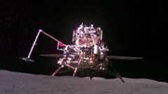 A photo of a lunar lander with a Chinese flag on it