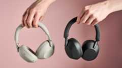 Person holding Sony WH-1000XM6 and Sony WH-1000XM5