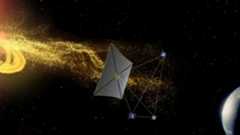 a rectangular kite-like spacecraft flies between a helix of yellow particles and earth on a starry black background