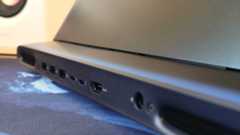 An Alienware 16 Area-51 laptop on a wooden desk