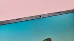 Close-up of camera on Acer Chromebook Plus 516 with pink background