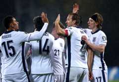 RIGA, LATVIA - OCTOBER 14: Morgan Rogers, Harry Kane and Anthony Gordon of England celebrate their team&amp;apos;s fourth goal, an own goal scored by Maksims Tonisevs of Latvia (not pictured) during the FIFA World Cup 2026 qualifier match between Latvia and England at Daugava Stadium on October 14, 2025 in Riga, Latvia. (Photo by Carl Recine/Getty Images)