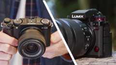 Fujifilm X-M5 in user&#039;s hands, Panasonic Lumix S1 II on a wooden surface outdoors