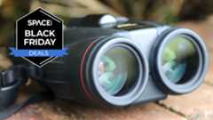 A pair of the Canon 10x42L IS WP binoculars on a brick wall with a Space.com Black Friday Deals badge in the left upper corner.