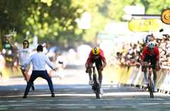 A demonstrator bursts onto the 2025 Tour de France stage 11 finish