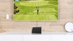 Mohu indoor TV antenna in front of a TV showing live sports