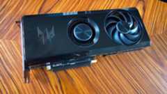 Acer Radeon RX 7600 graphics card on woodgrain table