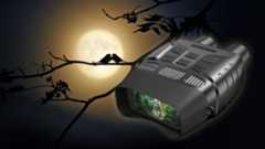 One of the best night vision binoculars in front of birds on a tree branch, silhouetted by a full moon in the background