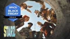 A group of people, including a robot with a lens for an eye, are looking down a concrete well.