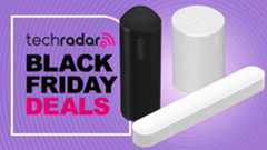 Sonos Roam, Sonos Era 100 and Sonos Beam with a sign saying &#039;Black Friday deals&#039;