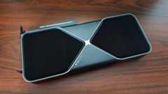 Nvidia GeForce RTX 5080 lying flat on woodgrain desk