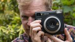 Fujifilm Instax SQ40 camera in reviewer&#039;s hands