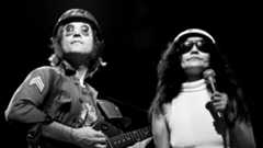 John Lennon and Yoko Ono onstage