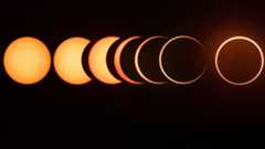 A composite image showing the stages of an eclipse, with the untouched solar disk shown on the left, partial eclipse phases in the middle and a fully eclipsed sun during annularity shown on the right against a black sky, with only its outer edge visible surrounding the moon's silhouette.