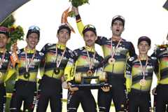 Belgian Tiesj Benoot of Team Visma-Lease a Bike, British Simon Philip Yates of Team Visma-Lease a Bike, American Sepp Kuss of Team Visma-Lease a Bike, Belgian Victor Campenaerts of Team Visma-Lease a Bike, Belgian Wout van Aert of Team Visma-Lease a Bike and Danish Jonas Vingegaard Hansen of Team Visma-Lease a Bike celebrate on the podium for winning the best team award after stage 21 of the 2025 Tour de France cycling race, from Mantes-la-Ville to Paris (120km), on Sunday 27 July 2025 in France. The 112th edition of the Tour de France starts on Saturday 5 July in Lille, France, and will finish in Paris, France on the 27th of July. BELGA PHOTO JASPER JACOBS (Photo by JASPER JACOBS / BELGA MAG / Belga via AFP)