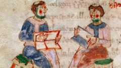 A painting of two balding monks sitting on green stools showing each other books